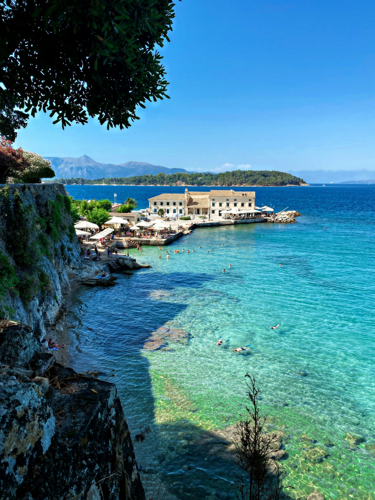 Clear turquoise bay and waterfront hotel